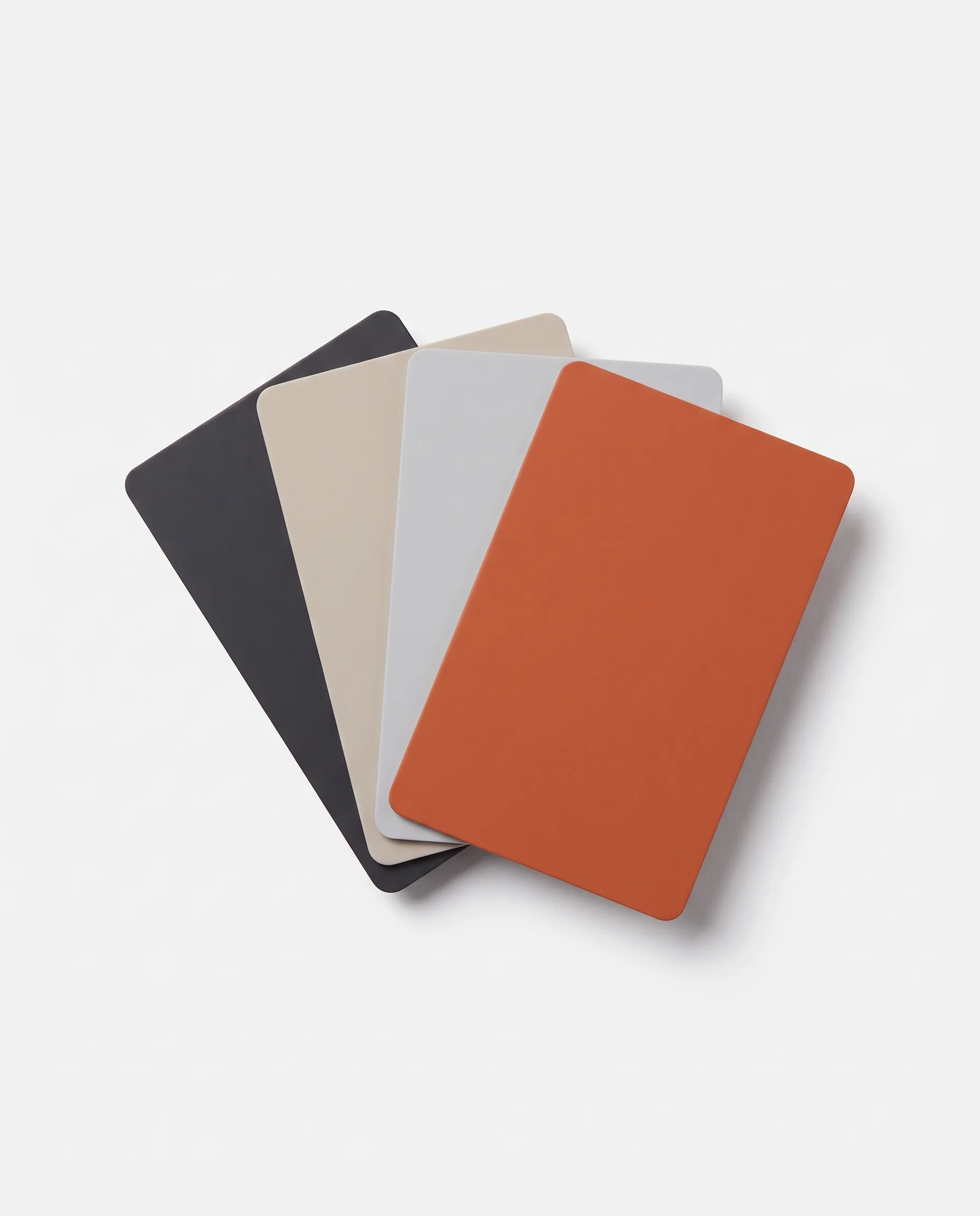 Four stock cards on white: Graphite, Sand, Fog, and Ember. The set ships Graphite, Sand, and Ember.
